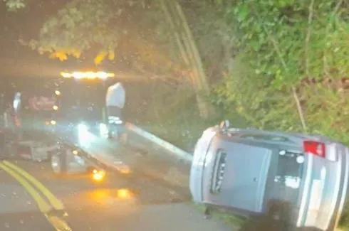 First Responders Pull Driver from Automobile After it Ends Up on its Side in Harrison County Accident