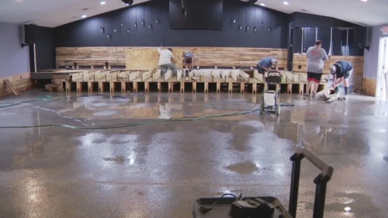 Church and community members help clean a church devastated by flooding