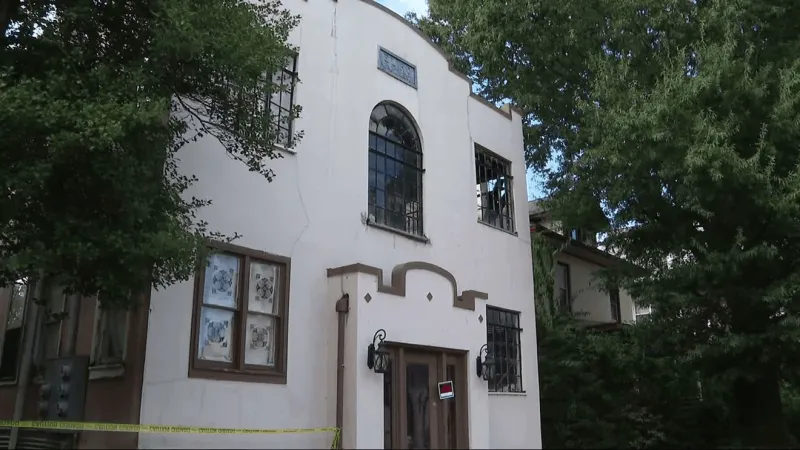 Resident says fire alarm never sounded in apartment building as flames spread