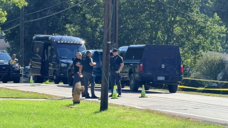 Two found slain in Marshall County home; suspect dead after taking juvenile hostage