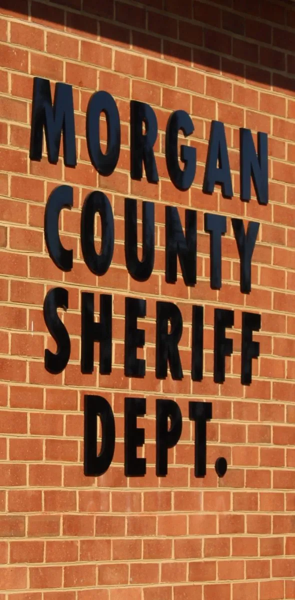 Police find cache of guns and ammo executing search warrant, charge local man