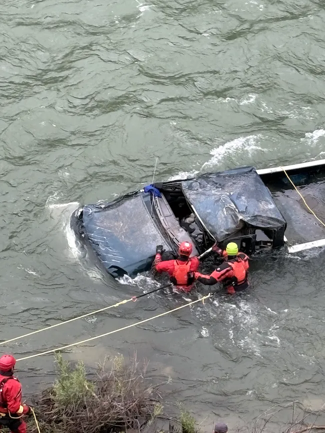 Truck careens through guardrail and rolls into Snake River