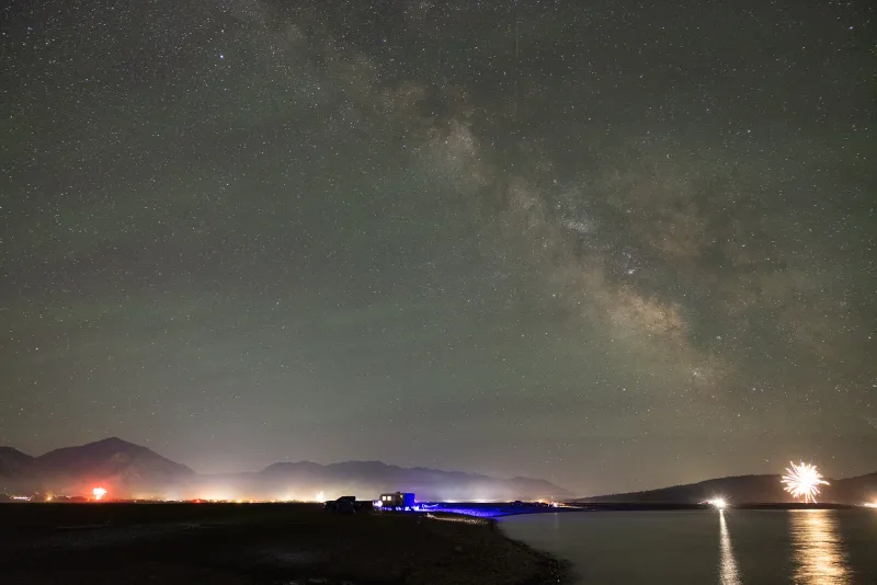 Milky Way, fireworks gleam over Palisades