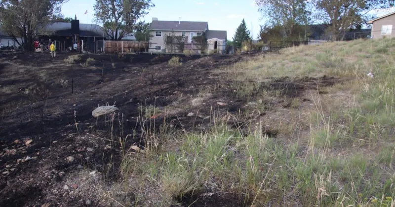 A fast-moving grass fire raced toward Casper homes. Here's what stopped it