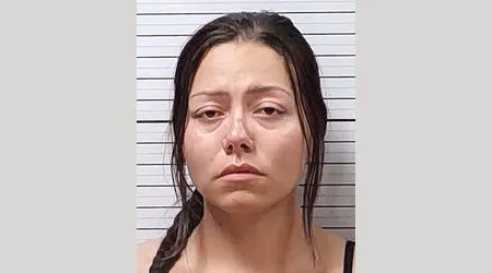 Woman charged with abusing Powell child