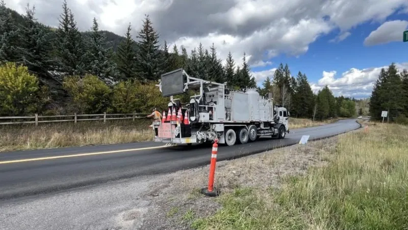 WYDOT painting stripes on newly paved sections of WY22